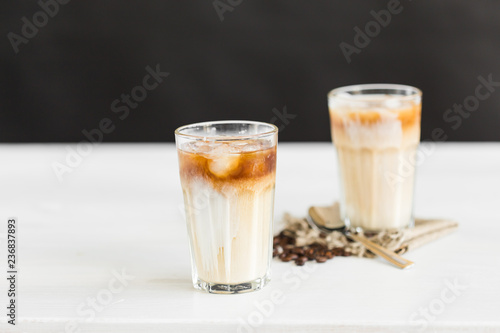 Delicious drink concept - Iced coffee in a glass with ice.