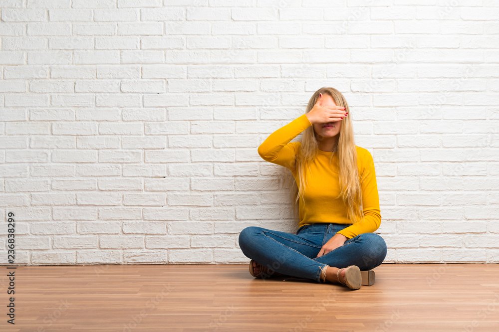 Young girl sitting on the floor covering eyes by hands. Do not want to see something Young girl sitting on the floor covering eyes by hands. Do not want to see something