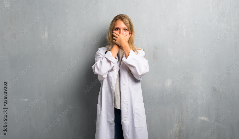 Young doctor woman covering mouth for saying something inappropriate. Can not speak Young doctor woman covering mouth for saying something inappropriate. Can not speak
