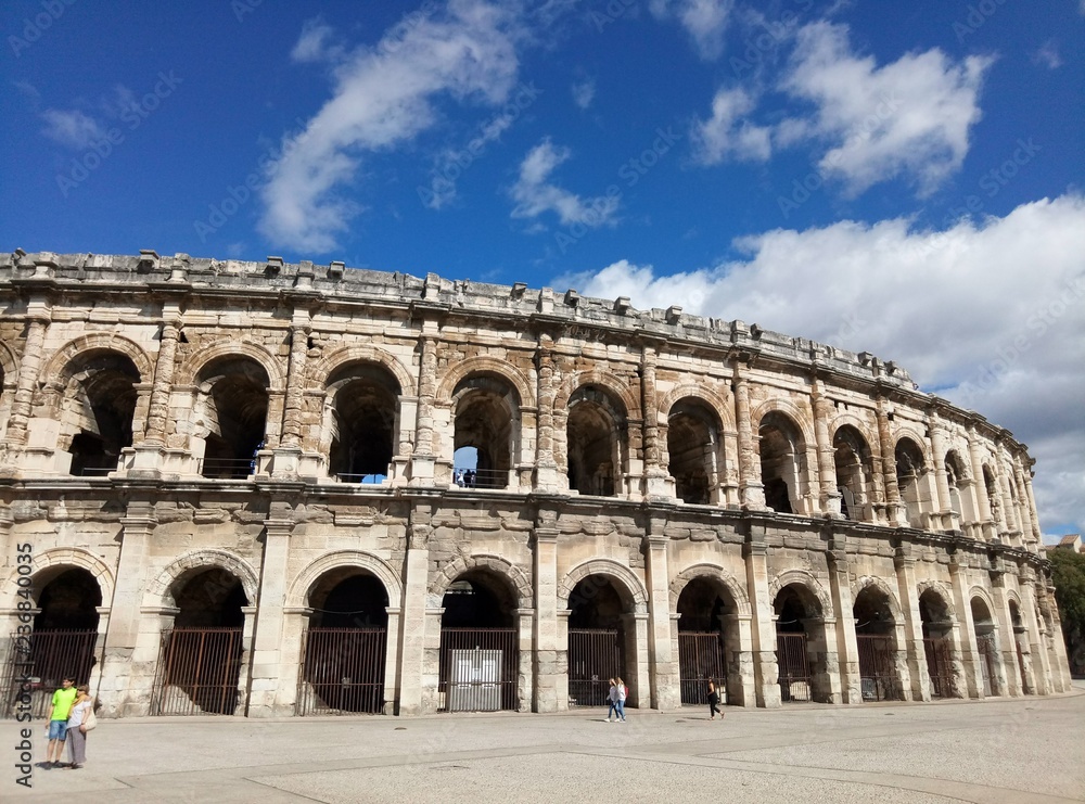 Ancient Roman Amphitheater in Nimes on a sunny day. Blue sky. Nimes, France.