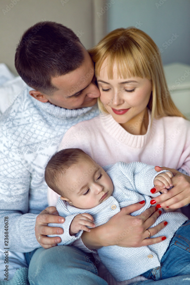 family with son sitting on the bed family with son sitting on the bed