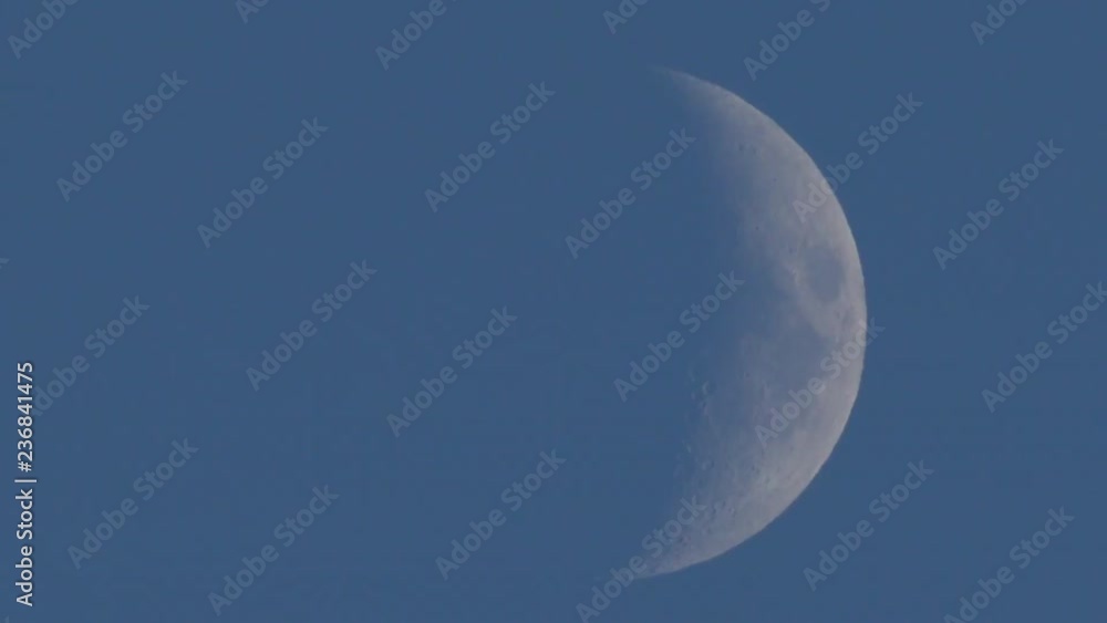 Extreme detail of waxing crescent moon seen with an astronomical telescope 4k UHD daylight footage - time-lapse fast motion Extreme detail of waxing crescent moon seen with an astronomical telescope 4k UHD daylight footage - time-lapse fast motion
