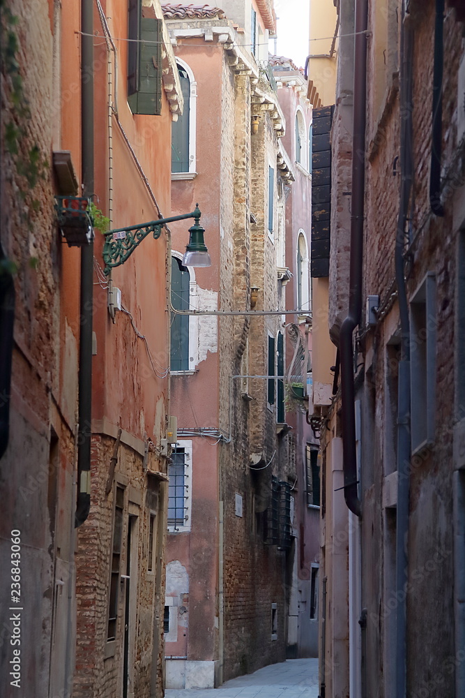 Venice, Italy. Vertical view of narrow street scene in Venice