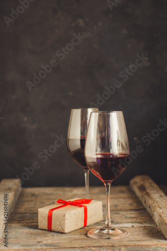 wine, red wine, transparent glass on a wooden table, a gift. Top view. copy space