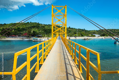 Yellow bridge between the islands of Nusa Cheningan and Nusa Lembongan photo