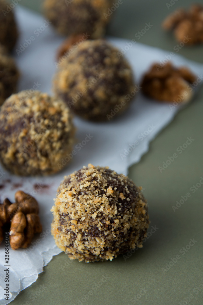 Energy healthy homemade truffles. Uncooked sweet balls made from walnuts and biscuits. Energy healthy homemade truffles. Uncooked sweet balls made from walnuts and biscuits.