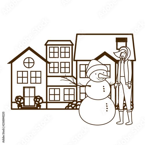 woman with snowman outside of the house