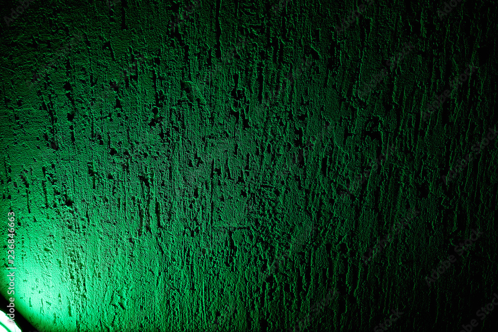 On a rough background a green beam of light