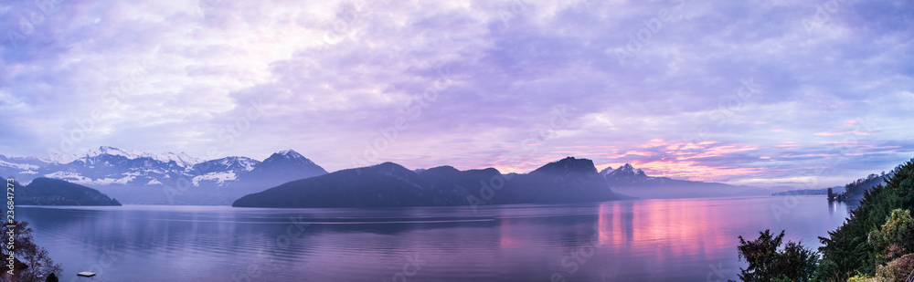 Panorama lilac sunset over Lucerne. Central Switzerland.