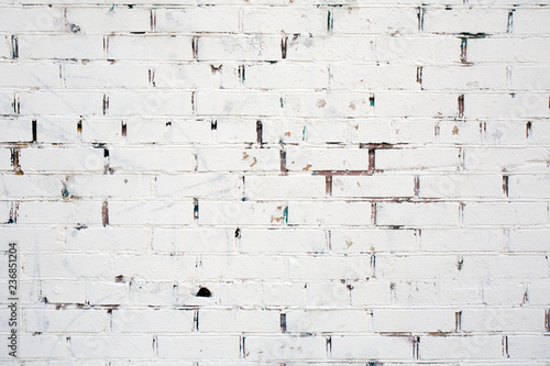Texture white cracked brick wall.