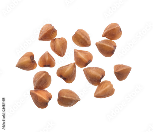 Grain buckwheat closeup isolated on white background.