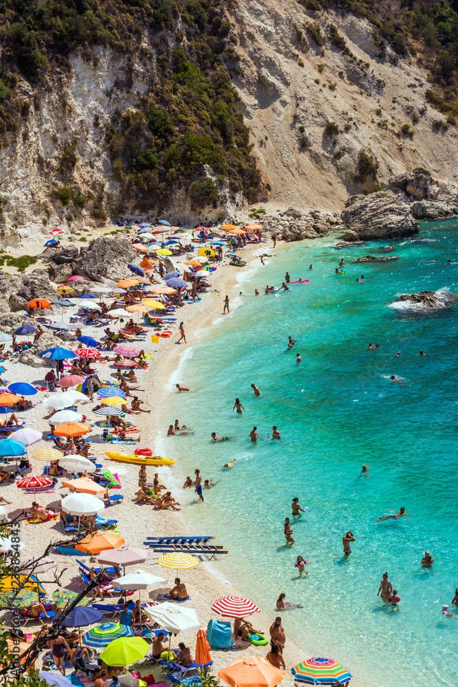 Lefkada island, Agiofilli beach, Greece. Summer holidays, many people on the beach, sea swimming