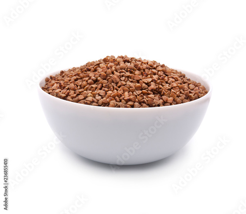 Buckwheat in white bowl isolated on white background.