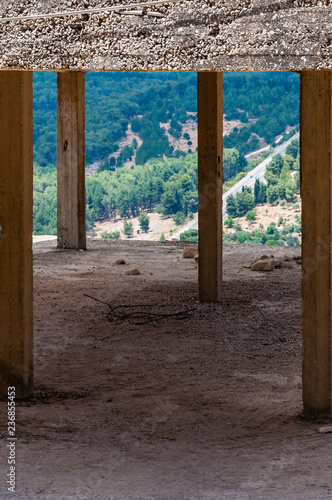 Concrete frame columns of the abandoned building in Old Town of Sefed with panorama to the North nature of Israel