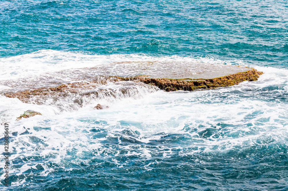 Fototapeta premium Rocks washed by water on Northern Mediterranean Sea Coast in Rosh Hanikra, Israel