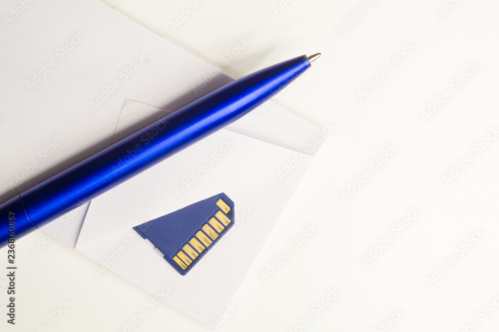 Memory card and blue pen with the paper background. business concept Memory card and blue pen with the paper background. business concept