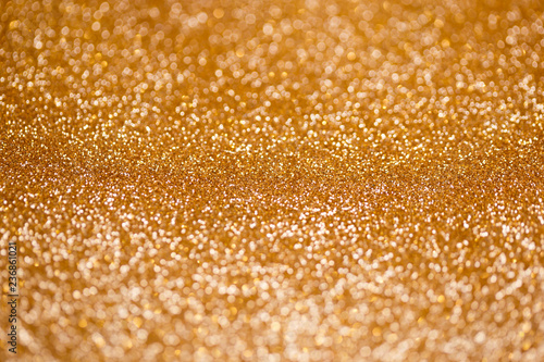 Defocused abstract golden christmas background with blinking lights