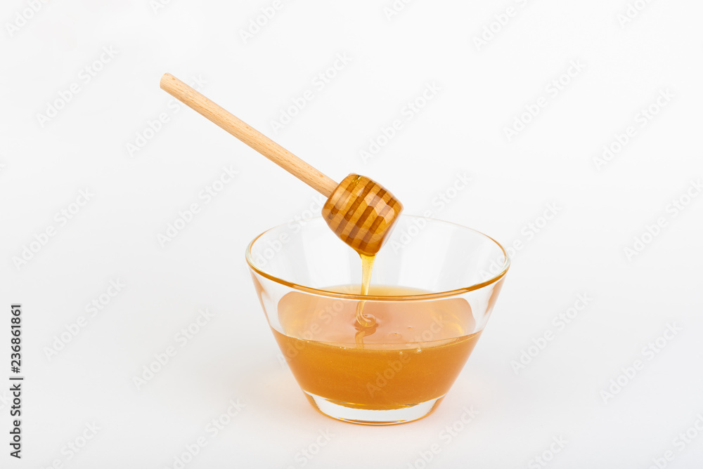 honey in jars on white table honey in jars on white table