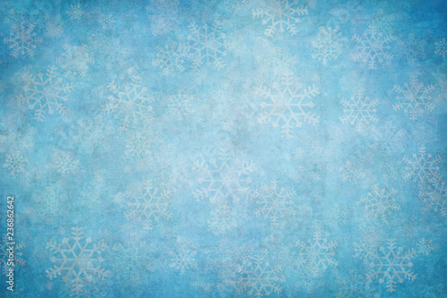 Blue winter background with snow flakes