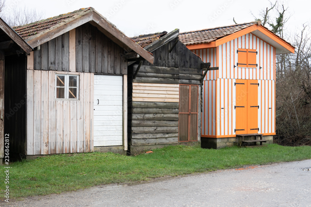 Wooden houses at ostreicole harbor of Biganos on the shore of Arcachon Bay in the Gironde department in France Wooden houses at ostreicole harbor of Biganos on the shore of Arcachon Bay in the Gironde department in France