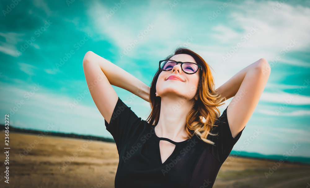 Portrait of young woman with eyeglasses at countryside Portrait of young woman with eyeglasses at countryside