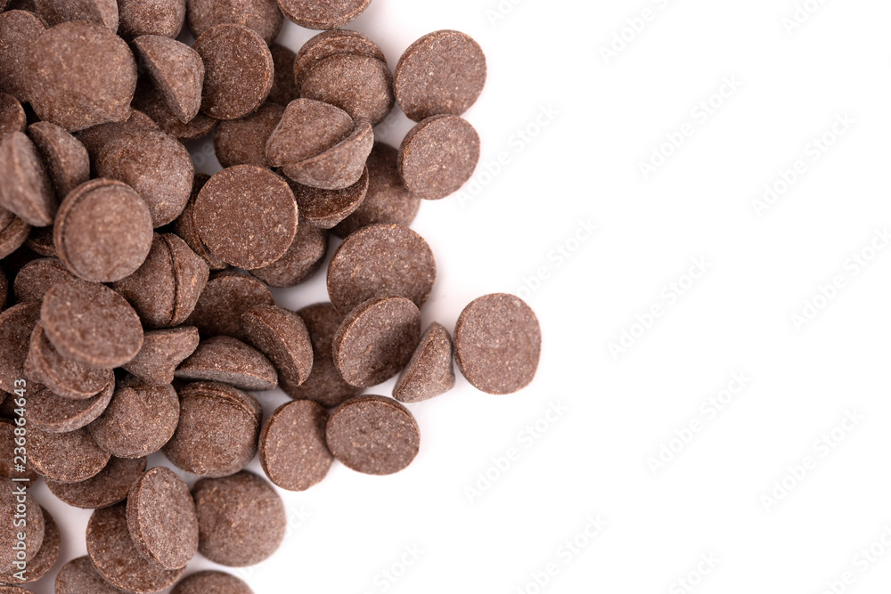 Pile of Unsweetened Carob Chips on a White Background Pile of Unsweetened Carob Chips on a White Background