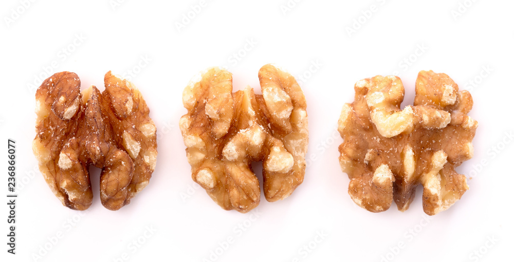 Line of Healthy Walnuts on a White Background Line of Healthy Walnuts on a White Background