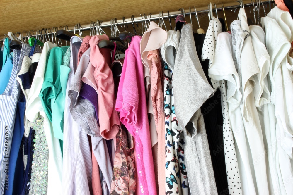 Group of blouses hung for a long time - with dust - in the closet