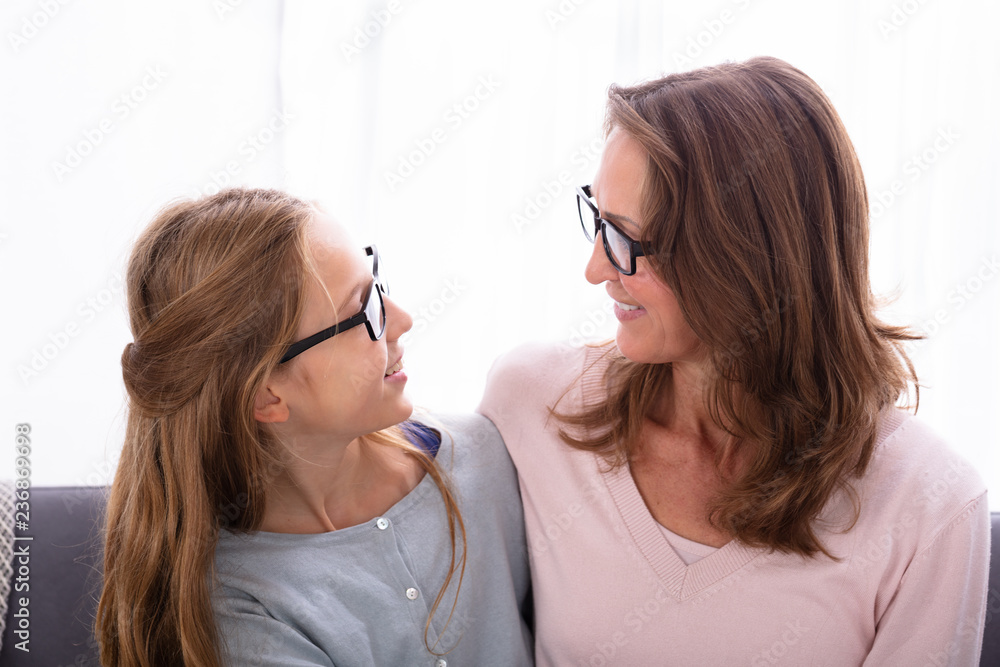 Mother And Daughter Looking At Each Other Mother And Daughter Looking At Each Other
