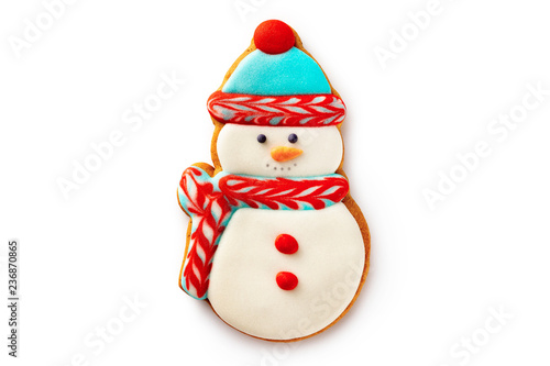 Closeup gingerbread christmas snowman cookie isolated at white background.