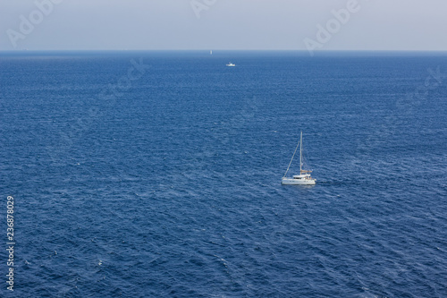 small white luxury yacht on sea surface tropic warm south natural environment summer vacation concept aerial shot from above, copy space 