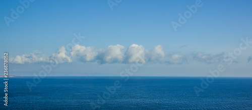 sea water surface to horizon line nature landscape panorama view with interesting shape of cloud in the sky similar to Rorschach test spot wallpaper concept, copy space © Артём Князь