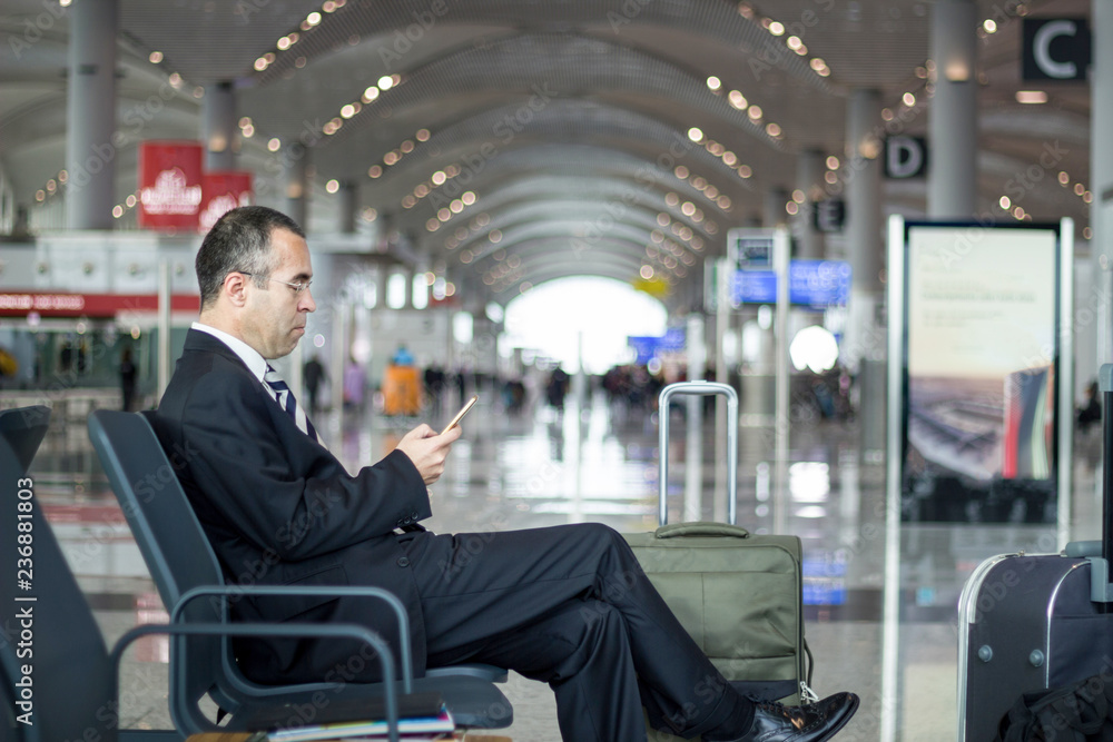 Business man at the airport talking with phone Business man at the airport talking with phone