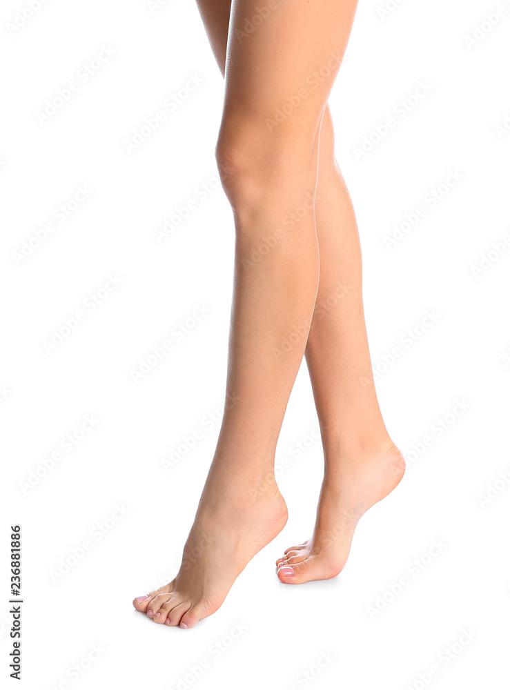 Woman with beautiful legs and feet on white background, closeup. Spa treatment Woman with beautiful legs and feet on white background, closeup. Spa treatment
