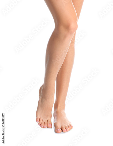 Woman with beautiful legs and feet on white background, closeup. Spa treatment © New Africa