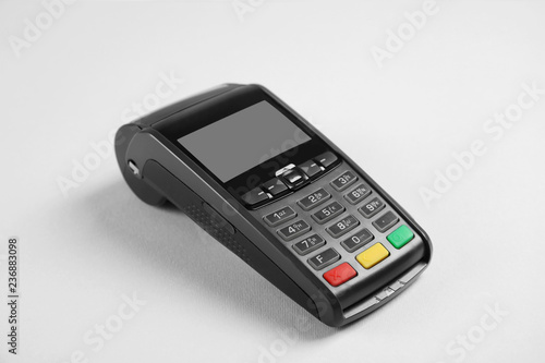 New modern payment terminal on grey background