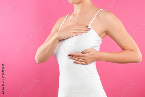 Wallpaper Mural Woman checking her breast on color background, closeup Torontodigital.ca