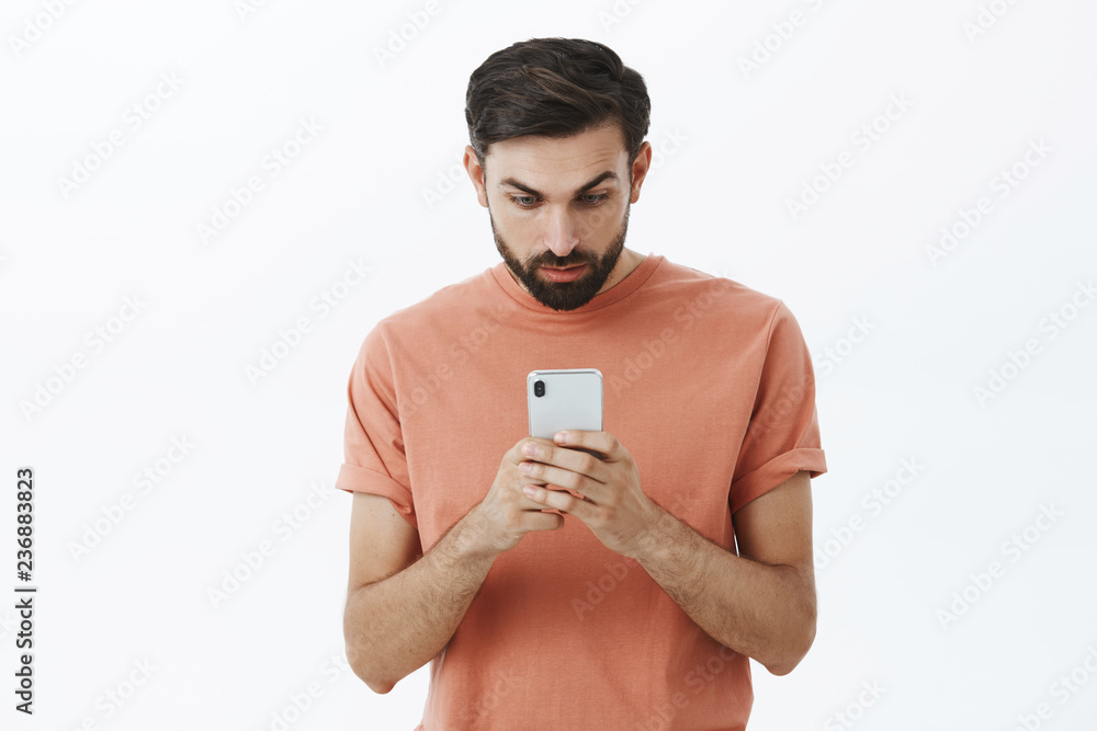 Mobile gadget dependence. Man bearded hipster play smartphone