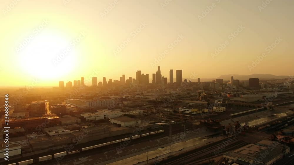 Aerial Shot of Los Angeles Downtown Sunset Skyline and Warehouses Aerial Shot of Los Angeles Downtown Sunset Skyline and Warehouses