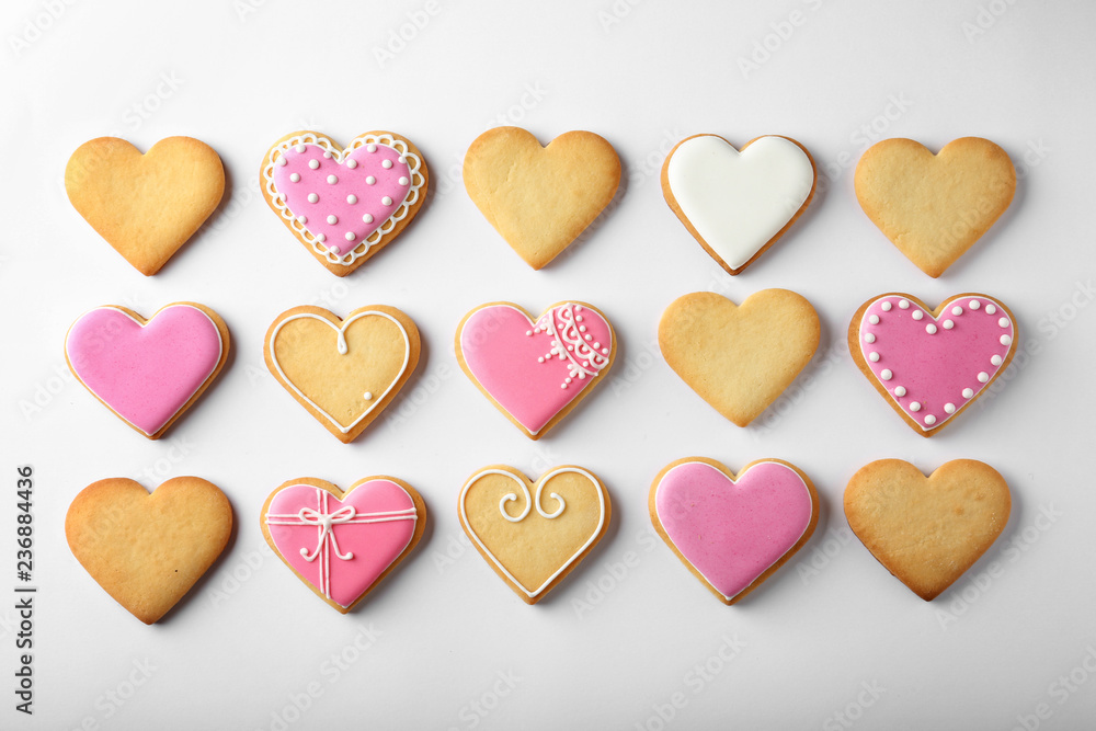 Decorated heart shaped cookies on white background, top view Decorated heart shaped cookies on white background, top view