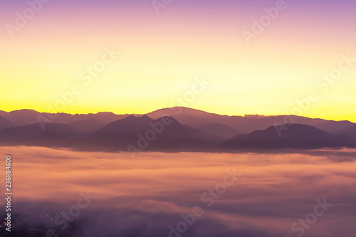  Landscape view of sunrise with white fog in early morning covered on the top of the hill at yun lai viewpoint, pai, Mae Hong Son, thailand