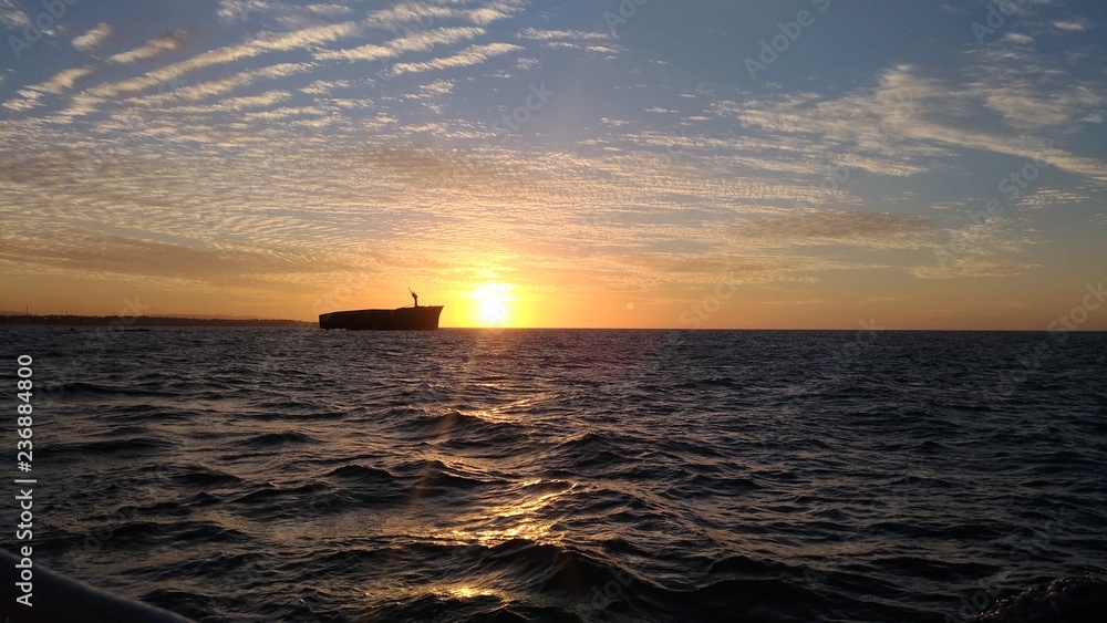 ship over sunset