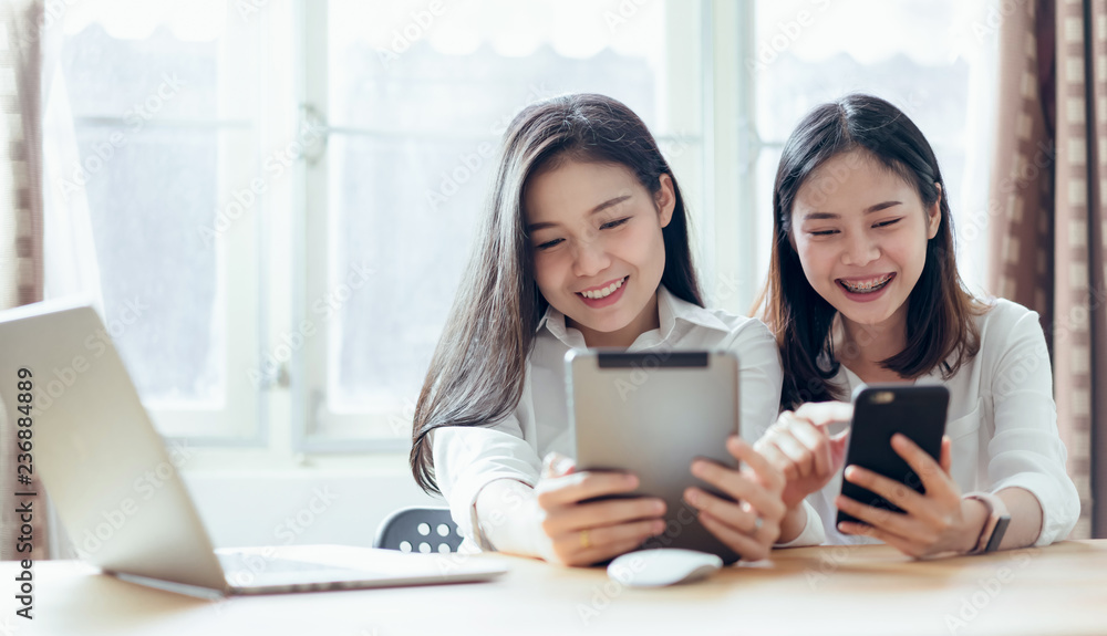 Woman using smartphone and tablet on the internet lifestyle. Concept of future and trend internet for easy access to information. Woman using smartphone and tablet on the internet lifestyle. Concept of future and trend internet for easy access to information.