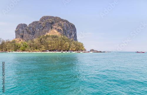 Landscape view of island limestone rock landmark popular of Poda island in andaman sea under blue sky on sunny day