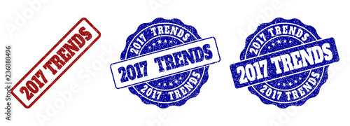 2017 TRENDS grunge stamp seals in red and blue colors. Vector 2017 TRENDS overlays with grunge style. Graphic elements are rounded rectangles, rosettes, circles and text tags.