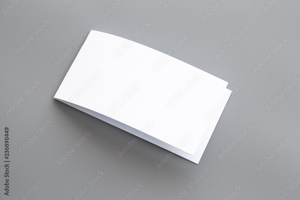 Blank portrait mock-up paper. brochure magazine isolated on gray, changeable background / white paper isolated on gray Blank portrait mock-up paper. brochure magazine isolated on gray, changeable background / white paper isolated on gray