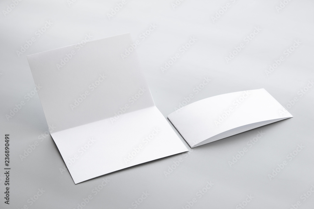 Blank portrait mock-up paper. brochure magazine isolated on gray, changeable background / white paper isolated on gray Blank portrait mock-up paper. brochure magazine isolated on gray, changeable background / white paper isolated on gray