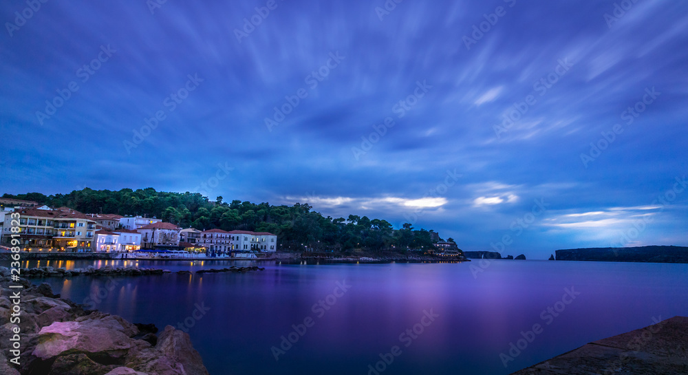 Panoramic view of the waterfront of Pylos at evening, blu hour, Greece.