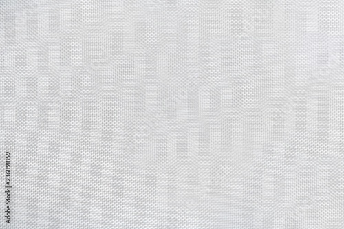 Texture of white canvas with material flake small pieces, abstract pattern background