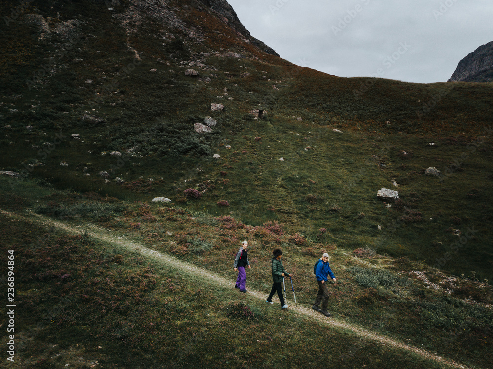Group of friends trekking in Glen Etive, Scotland Group of friends trekking in Glen Etive, Scotland